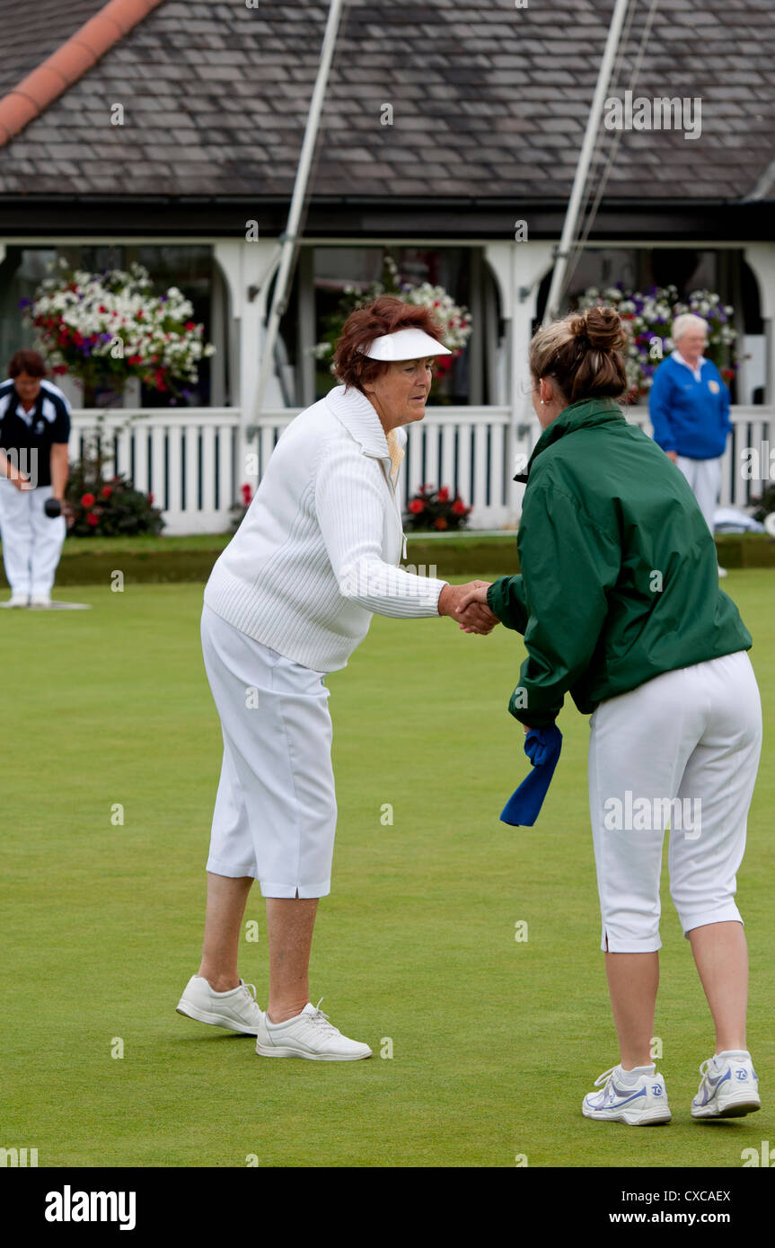 Women`s bowls, players shaking hands after match Stock Photo